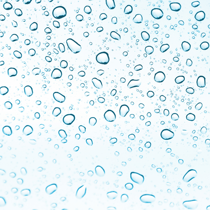 The image shows numerous water droplets on a clear surface, creating a pattern of various sizes of drops against a light blue background. The droplets are scattered evenly across the image, evoking a fresh and clean feeling, often associated with hydration and moisture.